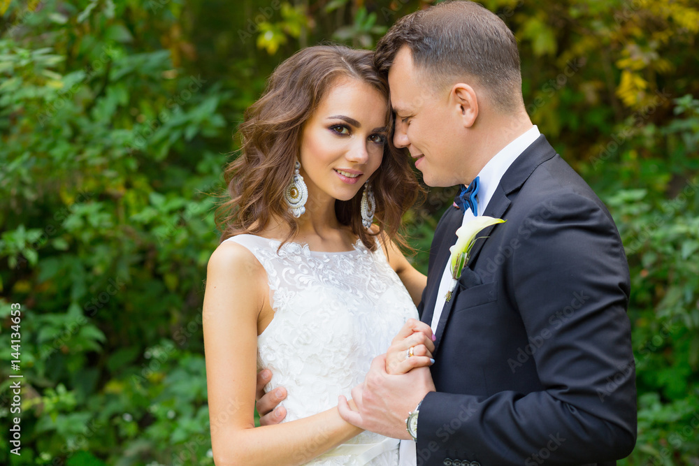 Elegant curly bride and stylish groom Elegant curly bride and stylish groom