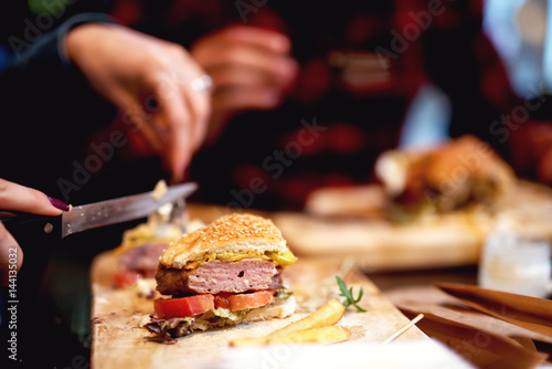 Delicious burger eating fast food. Street food.