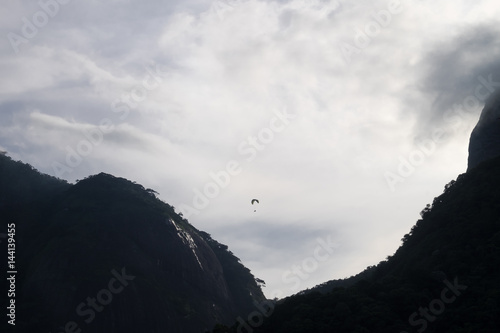 Paraglinder between Pedra da Gavea and Pedra Bonita mountains, R photo