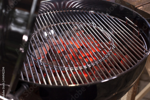 Empty Hot Charcoal Barbecue Grill With Flame. photo