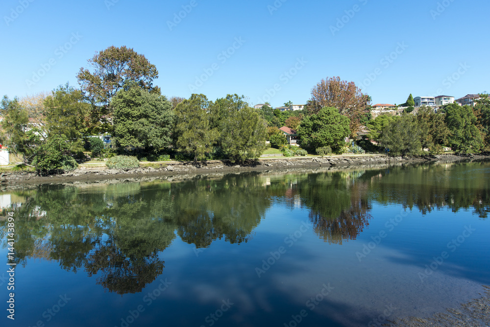 River reflections Cooks River sydney copyspace.