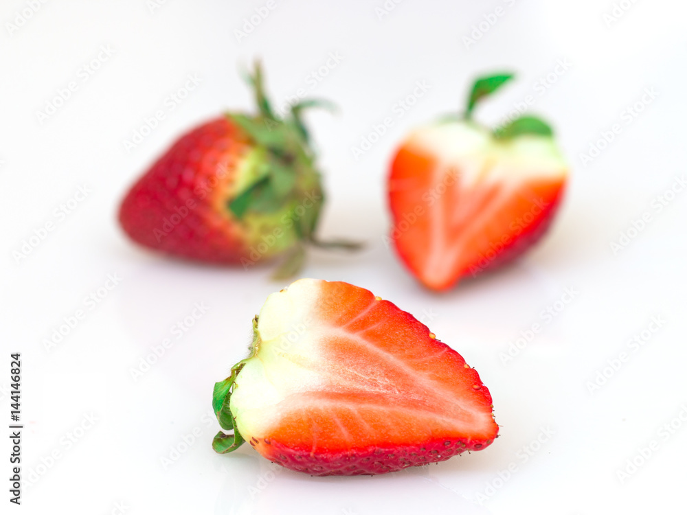Red strawberries on white background. Red strawberries on white background.