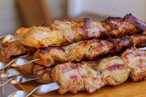 Grilling shashlik on barbecue grill.