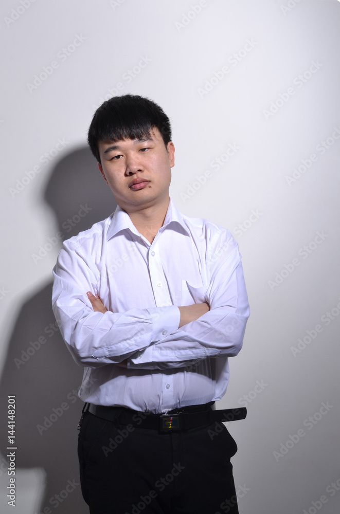 Young Asian business man portrait on white background. Young Asian business man portrait on white background.