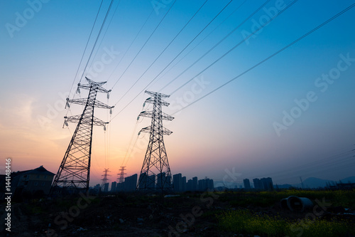 pylons in blue sky at sunrise