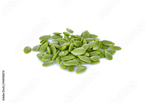 pile of white popinac seeds on white background