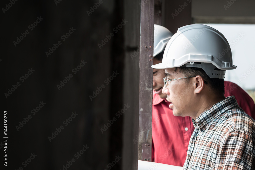 Portrait of engineer talking about construction job with commitment to success at construction site Portrait of engineer talking about construction job with commitment to success at construction site