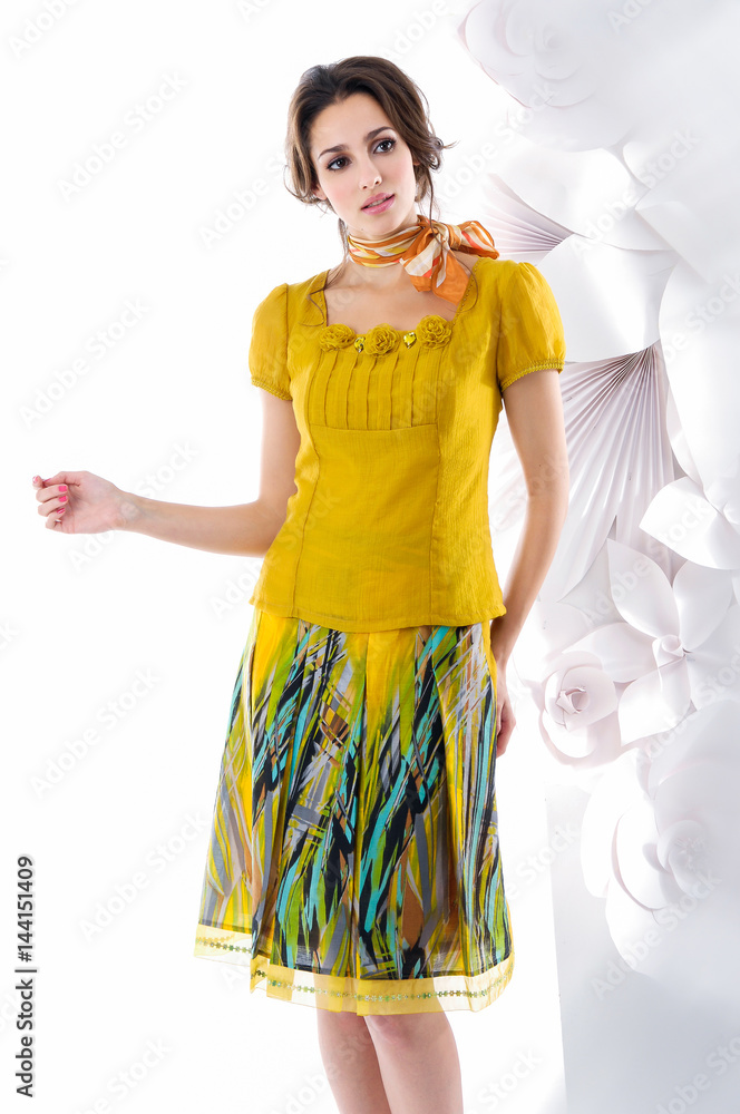beautiful young woman in spring dress posing in a studio. Fashion spring summer photo beautiful young woman in spring dress posing in a studio. Fashion spring summer photo