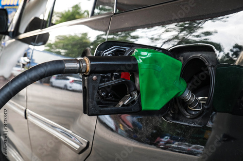 Close up, Car refueling on petrol station. Fuel pump with gasoline.