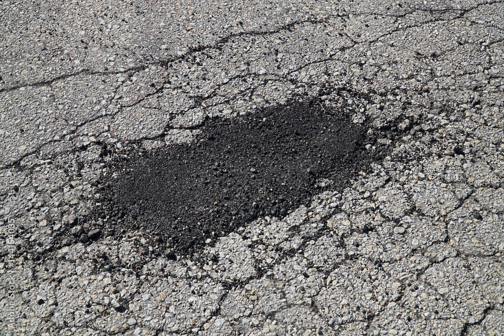 cracked asphalt road surface and repair patch cracked asphalt road surface and repair patch