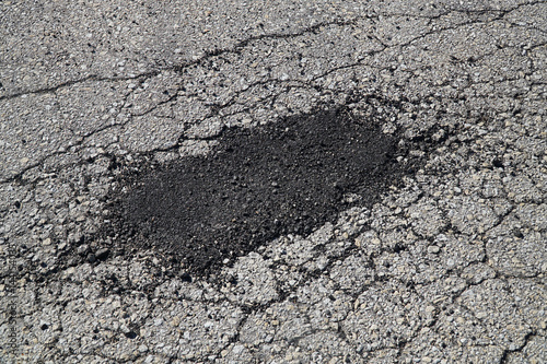 Wallpaper Mural cracked asphalt road surface and repair patch Torontodigital.ca