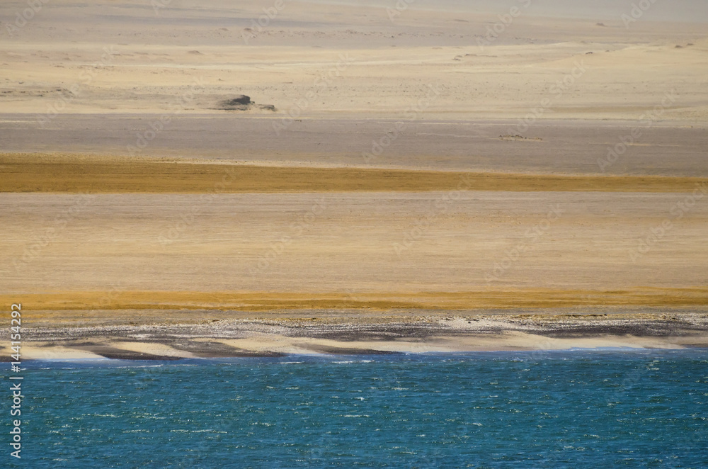 Aerial view to coastal line between ocean and desert Aerial view to coastal line between ocean and desert