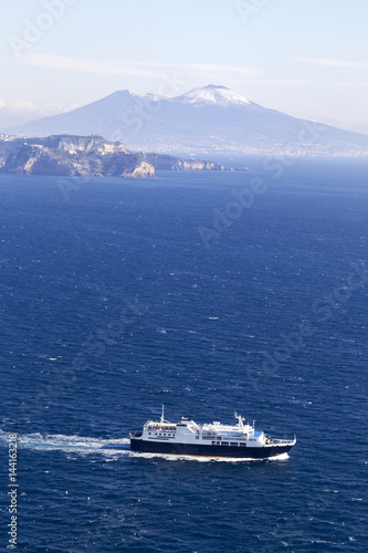 ship in gulf of naples and vesuvio in background