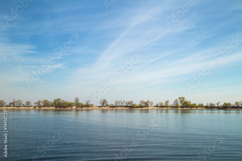 water reservoir landscape with Islands, blue sky, spring © Line