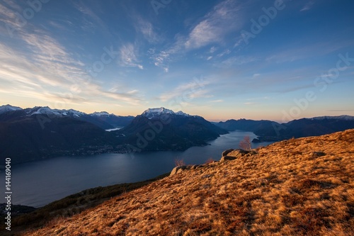 Grass on the ridges over Como Lake at dawn. High Lario, Lombardy, Italy Europe