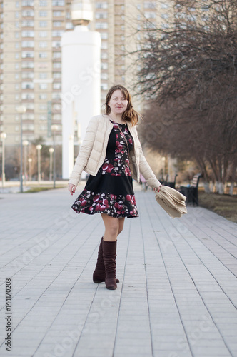 The cheerful woman smiles in the park in Tyumen.