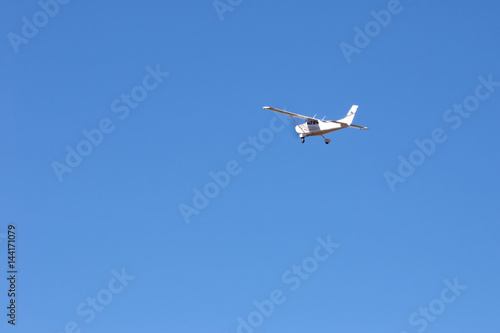 Small plane in clear blue sky