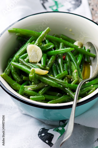 braised green beans with garlic. selective focus