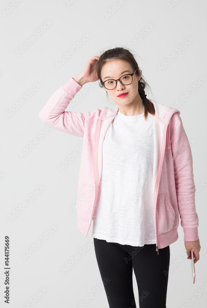 Portrait of beautiful young woman playing her mobile phone. Portrait of beautiful young woman playing her mobile phone.
