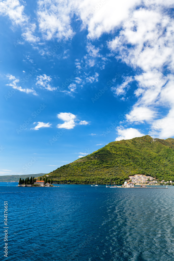 Summertime view of the Our Lady of the Rock and the Sveti Dordje churches on neighboring islands in the Bay of Kotor, Montenegro.