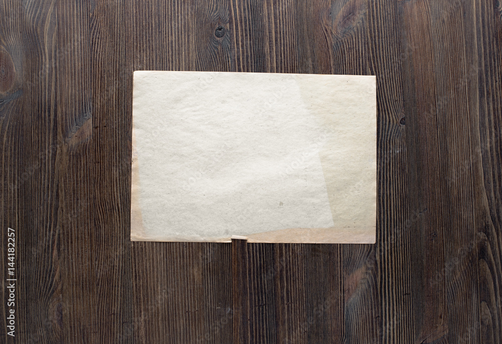 paper on wooden background paper on wooden background
