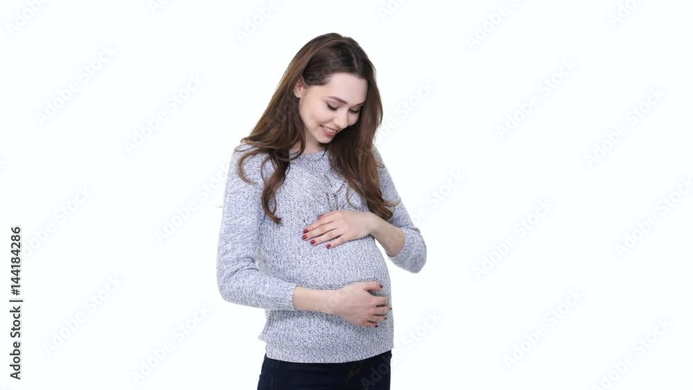 Happy pregnant woman expecting a baby and showing thumbs up gesture isolated over white Happy pregnant woman expecting a baby and showing thumbs up gesture isolated over white