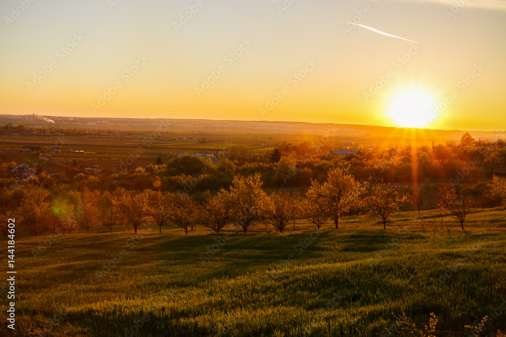 beautiful sunset over a field in rural country Romania