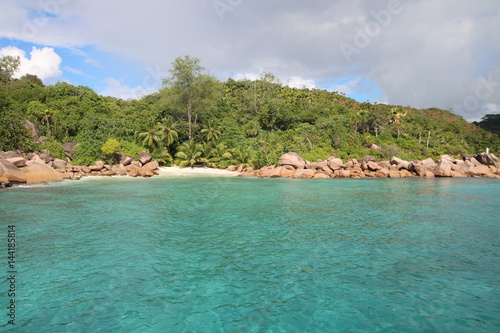 Beach close Anse Lazio, Praslin Island, Seychelles, Indian Ocean, Africa / The beautiful white sandy beach is bordered by large red granite rocks.  © sarlay