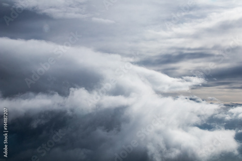 Clouds in the sky from airplane. Raining clouds aerial view.