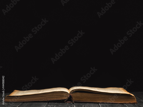 Open book on a black background