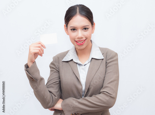 Beautiful smiling businesswoman with business card.