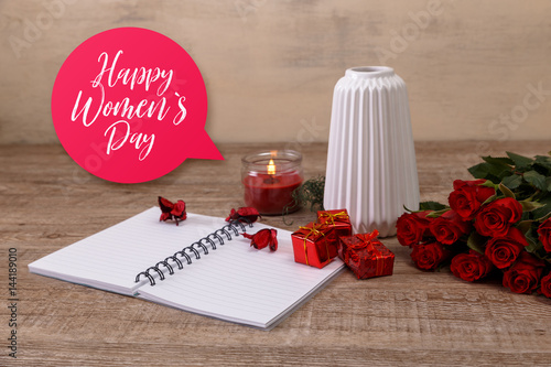 Red roses with gift boxes and vase. Happy Womens day, 8 march concept. Red pencil with notepad and candle. Love design. Wooden rustic board.