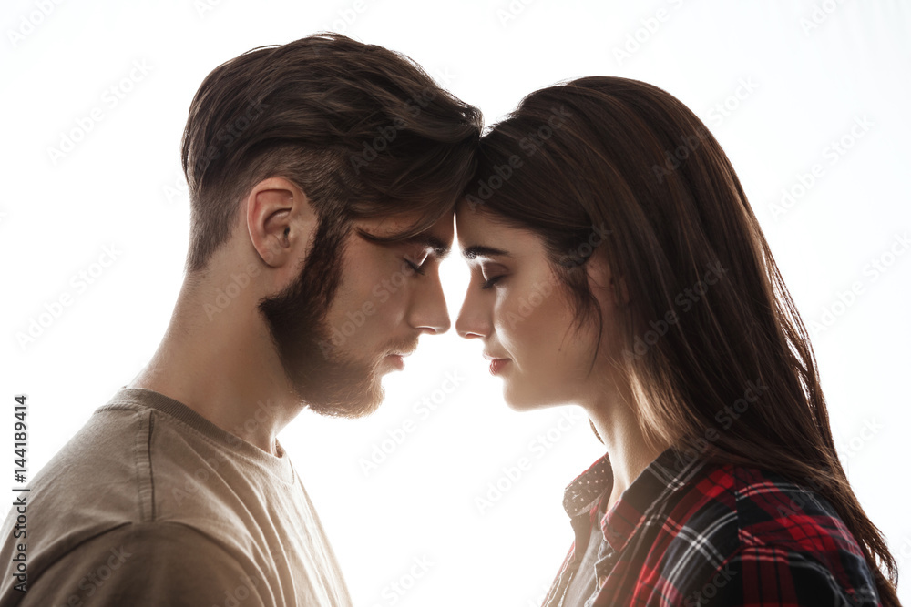 Head to head. Lovely couple enjoying good time. Eyes closed. Head to head. Lovely couple enjoying good time. Eyes closed.