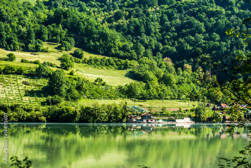 Landscape with green hills and the river Drina, which flows from the mountains