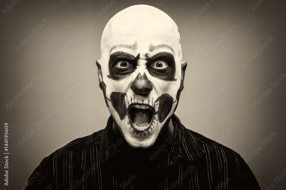 Beautiful man with creative make-up for the Halloween party Beautiful man with creative make-up for the Halloween party