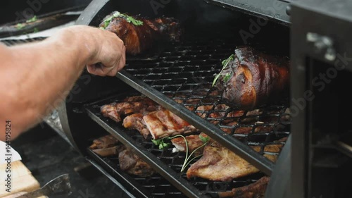 Man's hands prepring food on grill photo