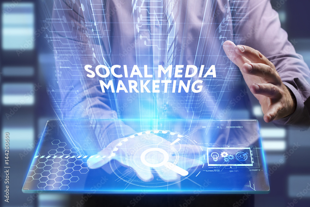 Business, Technology, Internet and network concept. Young businessman working on a virtual screen of the future and sees the inscription: Social media marketing Business, Technology, Internet and network concept. Young businessman working on a virtual screen of the future and sees the inscription: Social media marketing