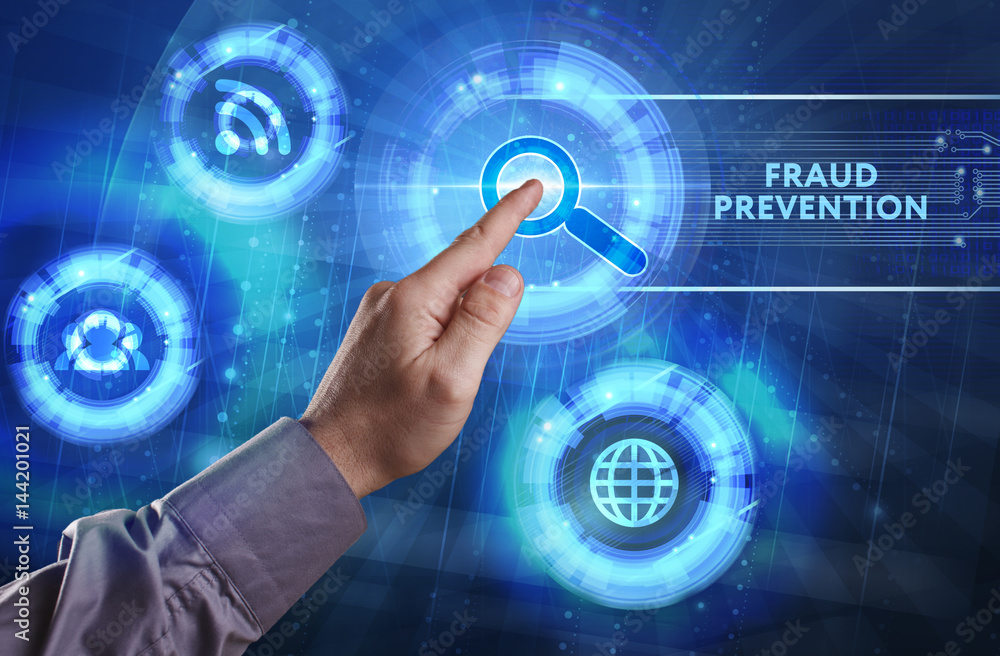Obraz premium Business, Technology, Internet and network concept. Young businessman working on a virtual screen of the future and sees the inscription: Fraud prevention