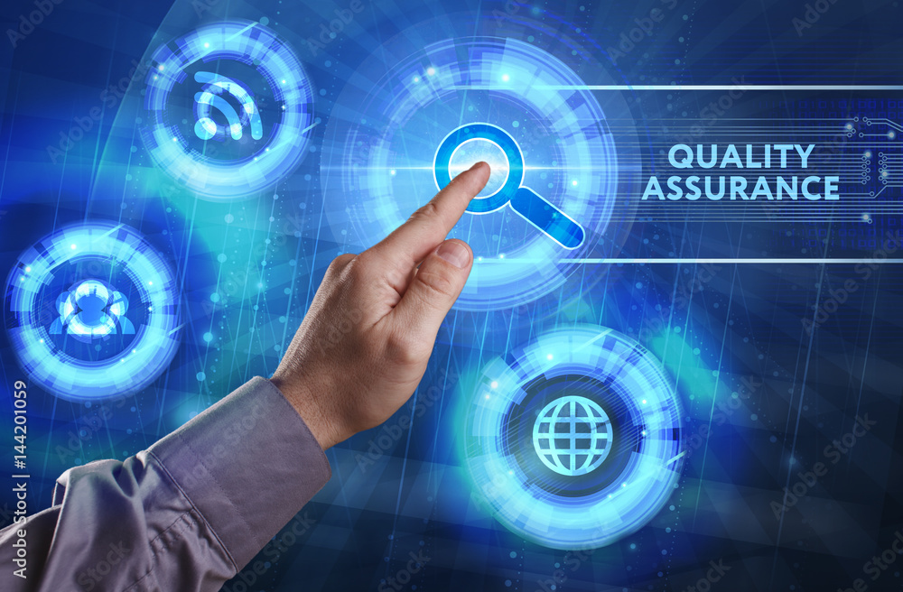 Obraz premium Business, Technology, Internet and network concept. Young businessman working on a virtual screen of the future and sees the inscription: Quality assurance