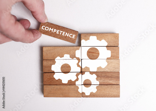 Business, Technology, Internet and network concept. Young businessman shows the word: Competence photo