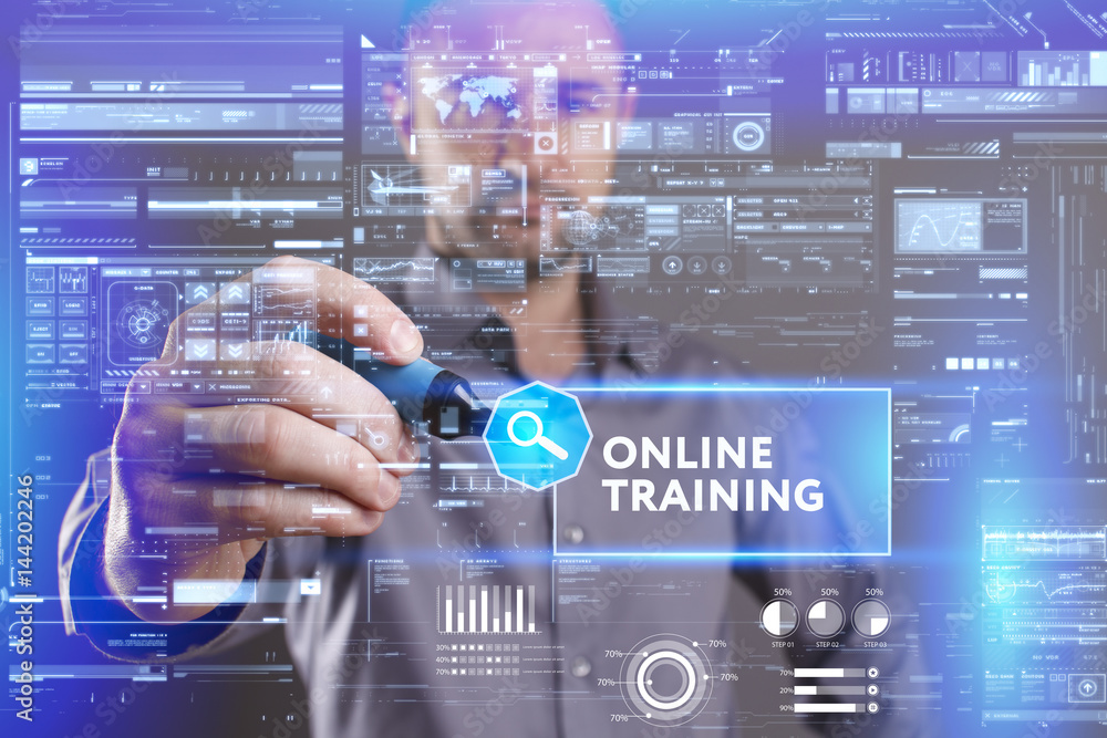Business, Technology, Internet and network concept. Young businessman working on a virtual screen of the future and sees the inscription: Online training Business, Technology, Internet and network concept. Young businessman working on a virtual screen of the future and sees the inscription: Online training