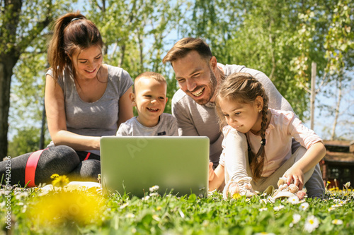 Family using laptop.