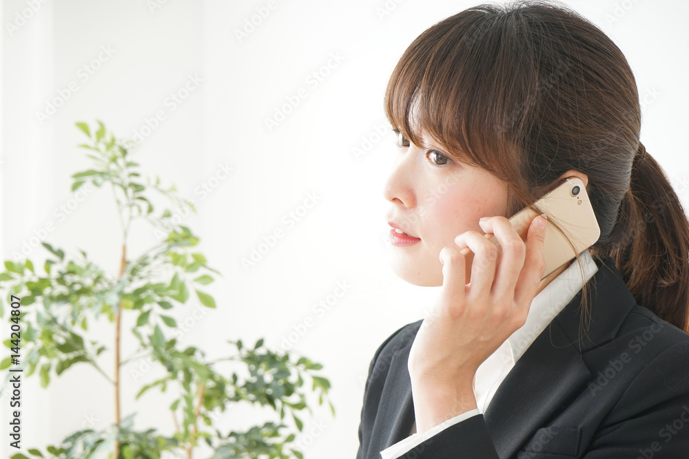 Young business woman talking on the phone Young business woman talking on the phone