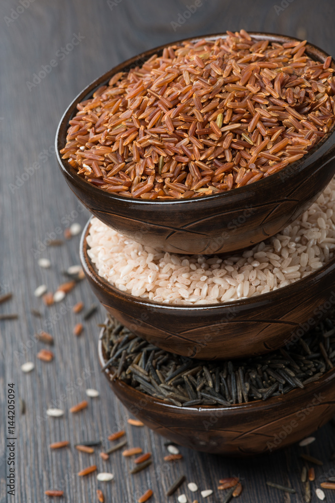 red, wild and pink rice in a bowl, top view red, wild and pink rice in a bowl, top view
