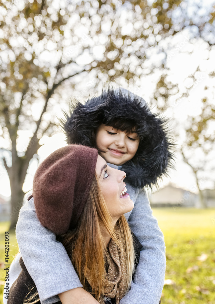 Mother with her little daughter in autumnal park Mother with her little daughter in autumnal park