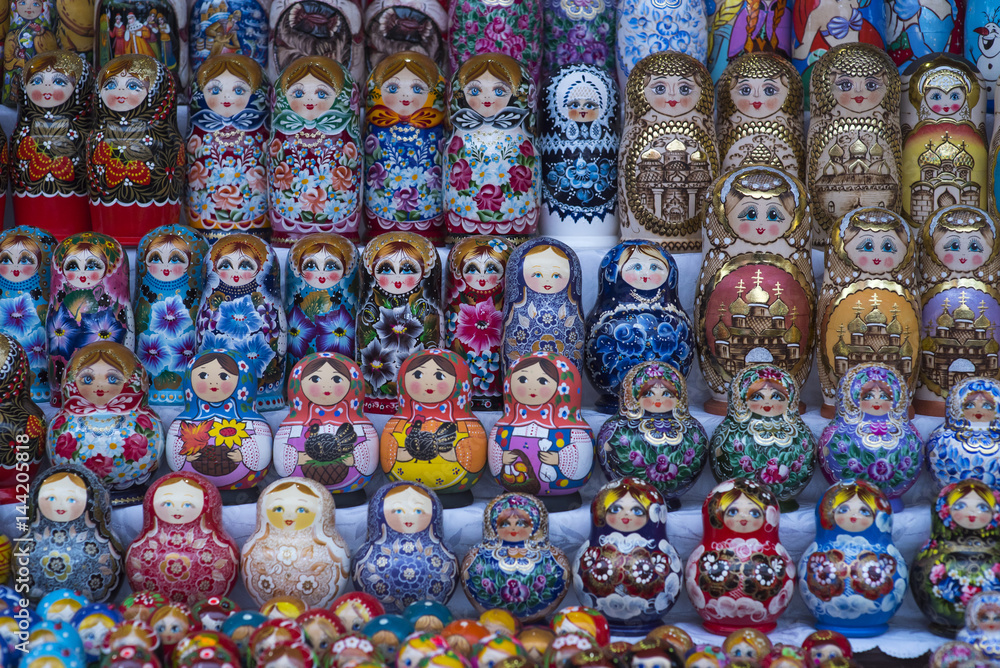 Beautiful colourful wooden dolls matryoshka at market. Matryoshka dolls is folks cultural symbol of Russia Beautiful colourful wooden dolls matryoshka at market. Matryoshka dolls is folks cultural symbol of Russia
