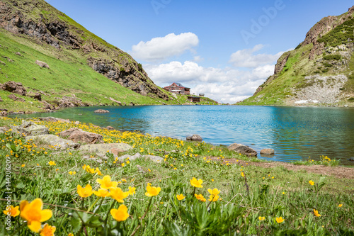 Mountain landscape with lake and mountain hut in Tyrol  Fieberbrunn  Austria