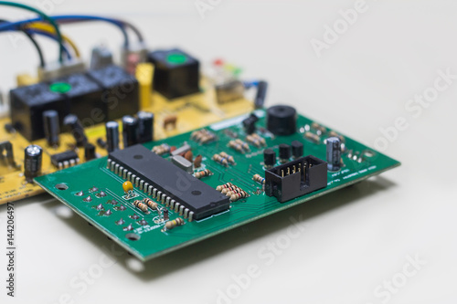 Closeup on electronic board power supply,blurred and toned image,focus on the device