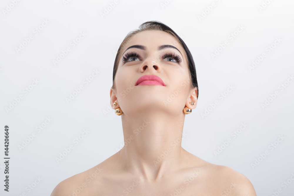 Front portrait of female neck on grey background close up. girl with clean and lifted skin Front portrait of female neck on grey background close up. girl with clean and lifted skin