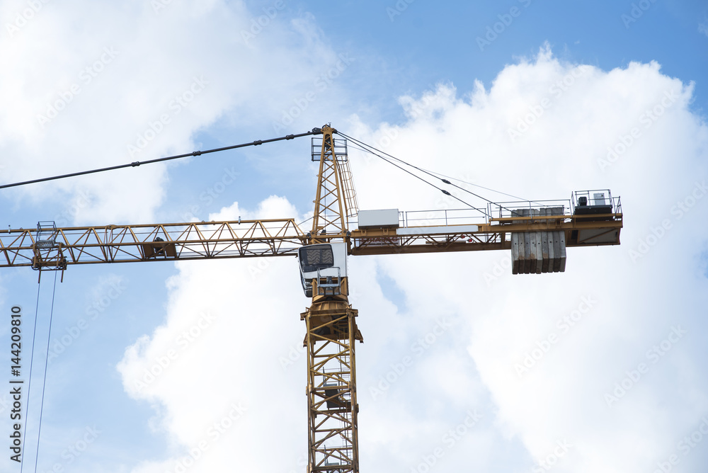 Abstract Industrial background with construction cranes silhouettes over amazing sunset sky